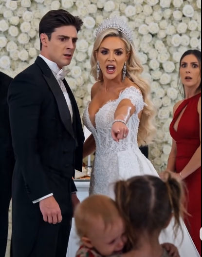 A little girl carrying a baby sister interrupted a billionaire wedding… then she called the groom “Daddy” in front of everyone.