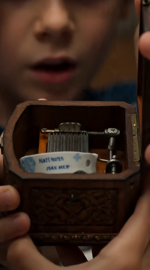 “The boy opened his mother’s music box… and found the name they buried for ten years.”
